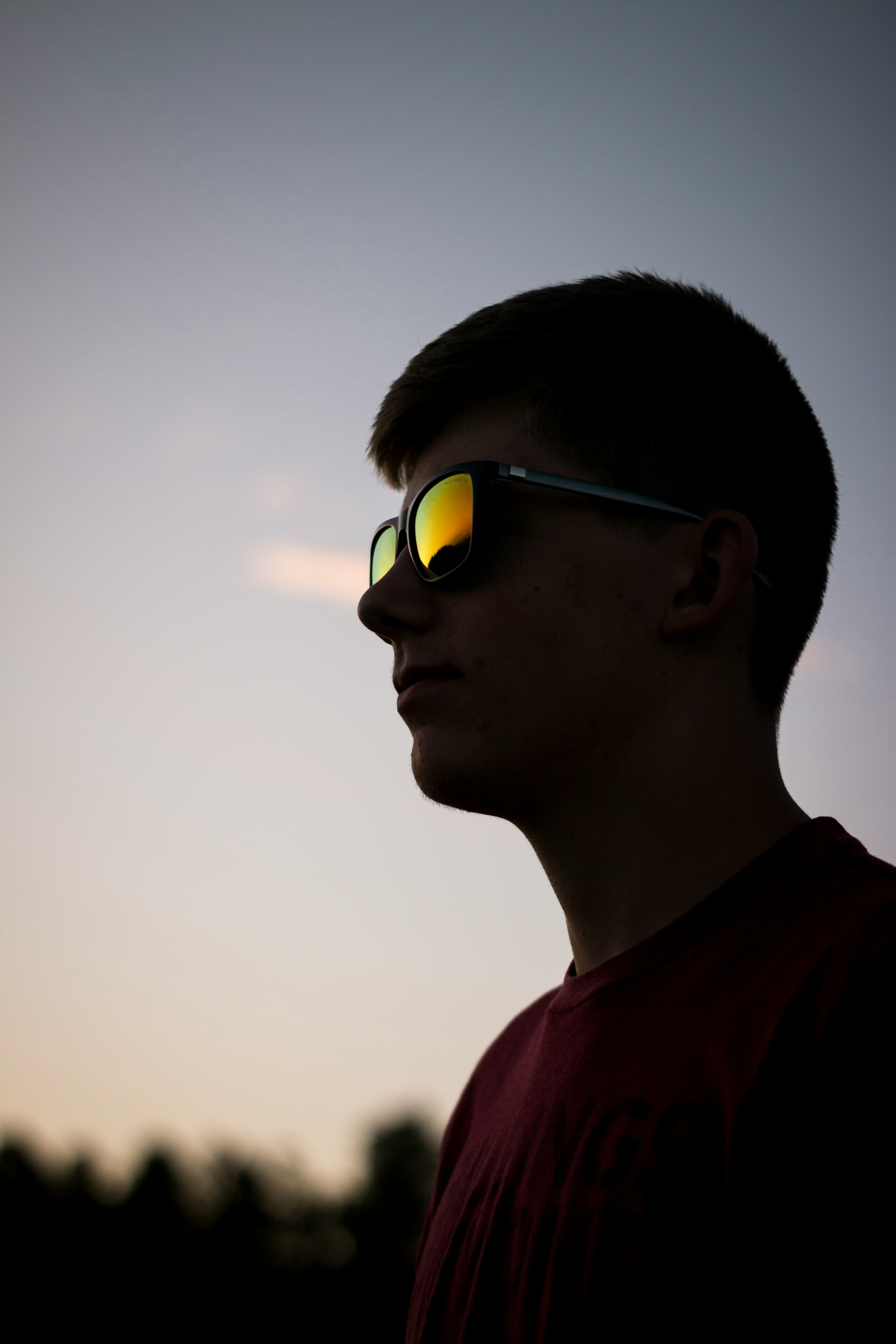 shallow focus photography of man wearing sunglasses